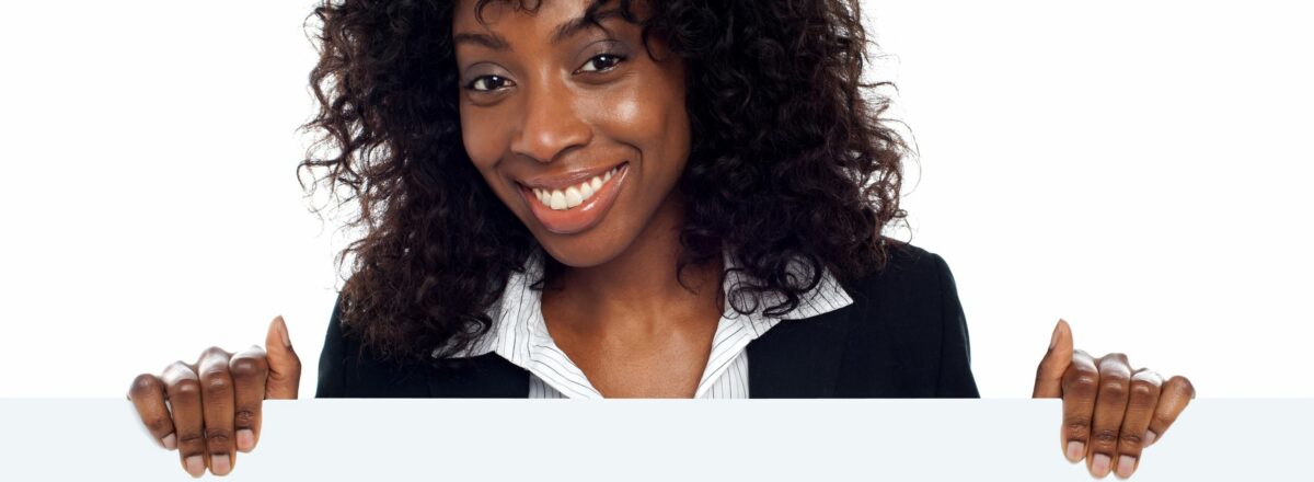 14087765 - portrait of happy young woman holding blank billboard against white background